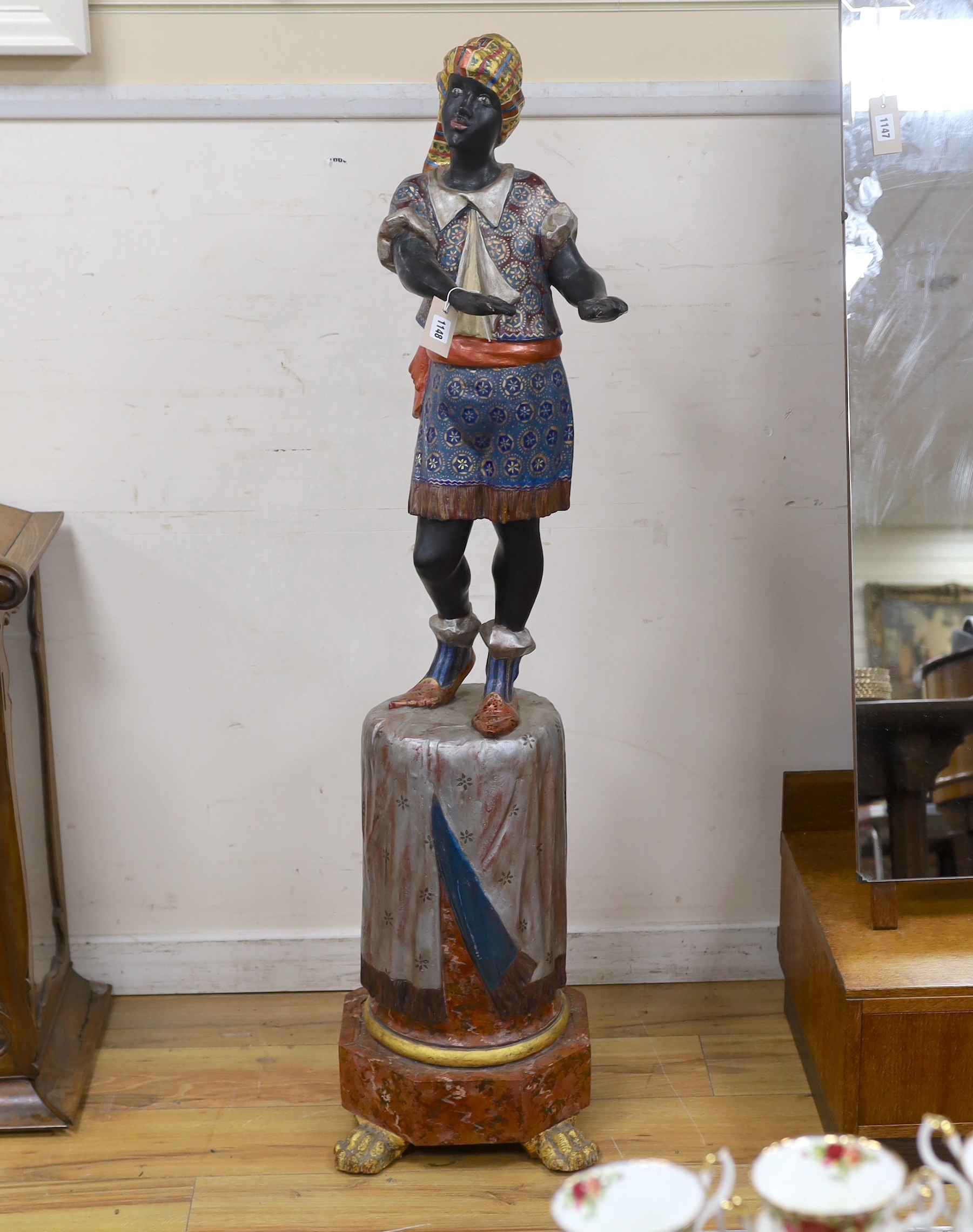 A painted composition Blackamoor waiter, lacking tray, height 142cm